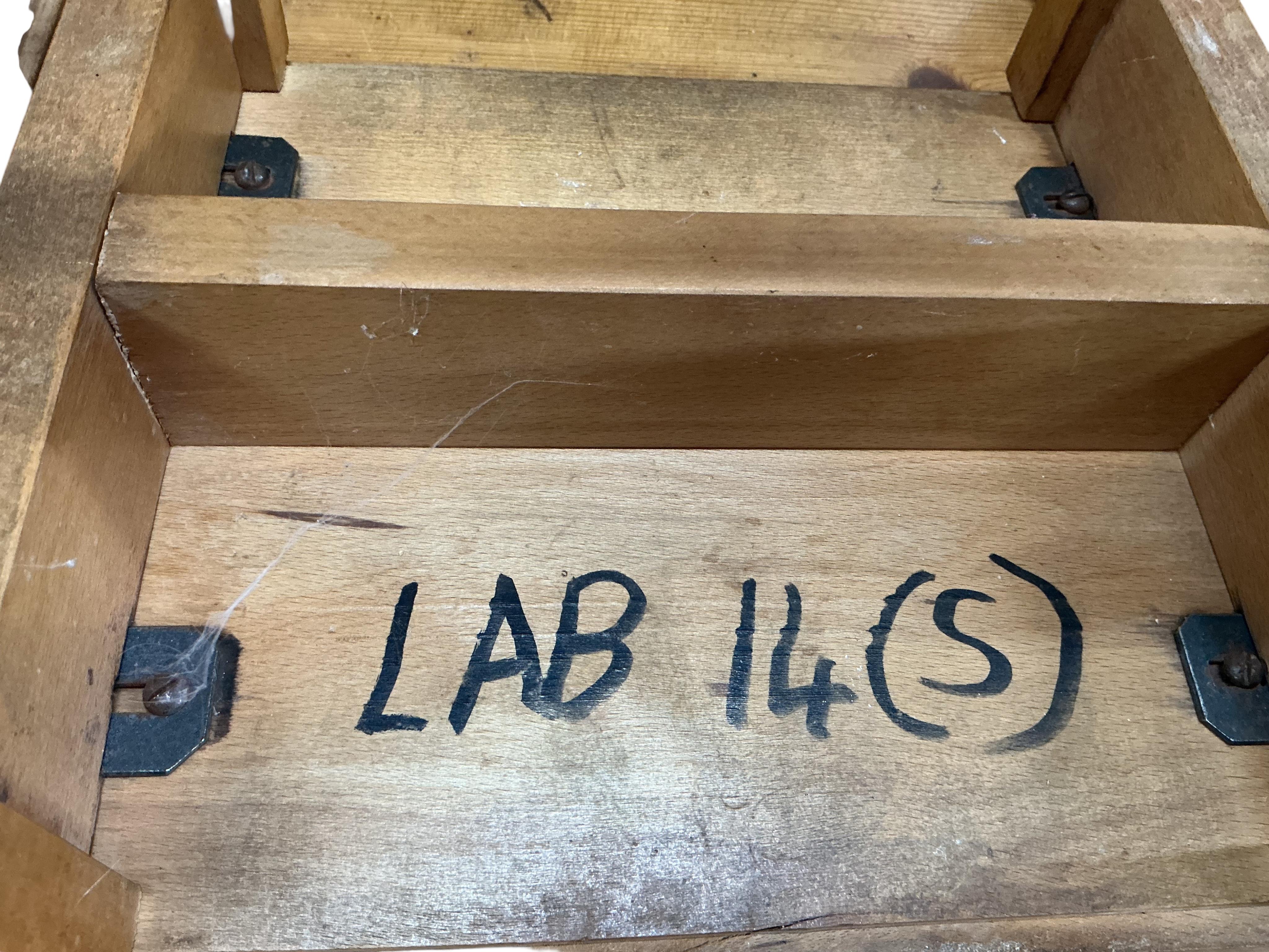 Twelve mid century beech and hardwood laboratory stools, height 65cm